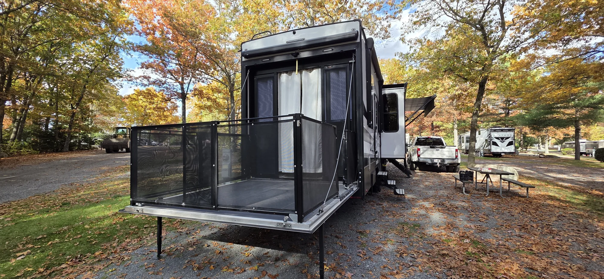 The actual Marginalia retreat with its patio open beneath fall foliage